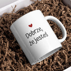 Kubek biały z napisem "DOBRZE, ŻE JESTEŚ" - 330 ml
