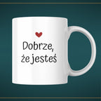 Kubek biały z napisem "DOBRZE, ŻE JESTEŚ" - 330 ml
